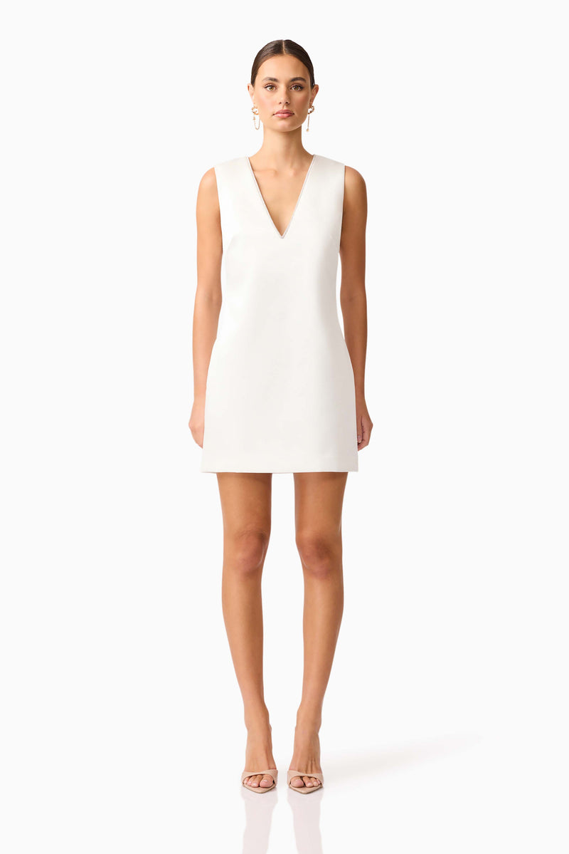 Brunette model wearing Livia Shift Mini Dress in white front shot