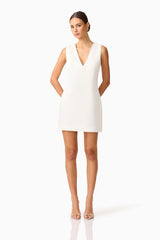 Brunette model wearing Livia Shift Mini Dress in white posed shot