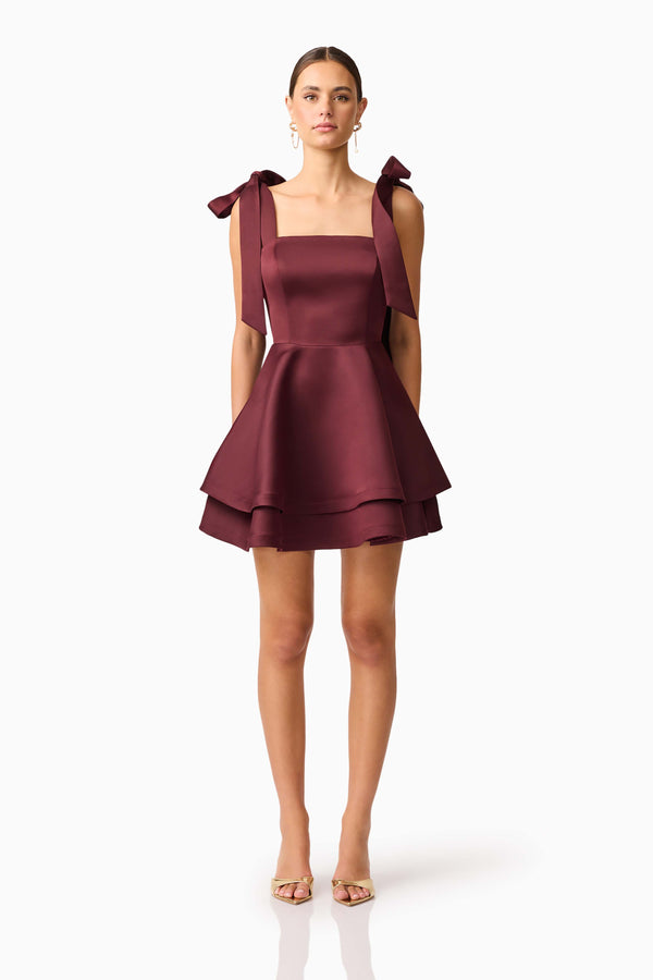 Brunette model wearing Livia Tiered Mini Dress in Red front shot
