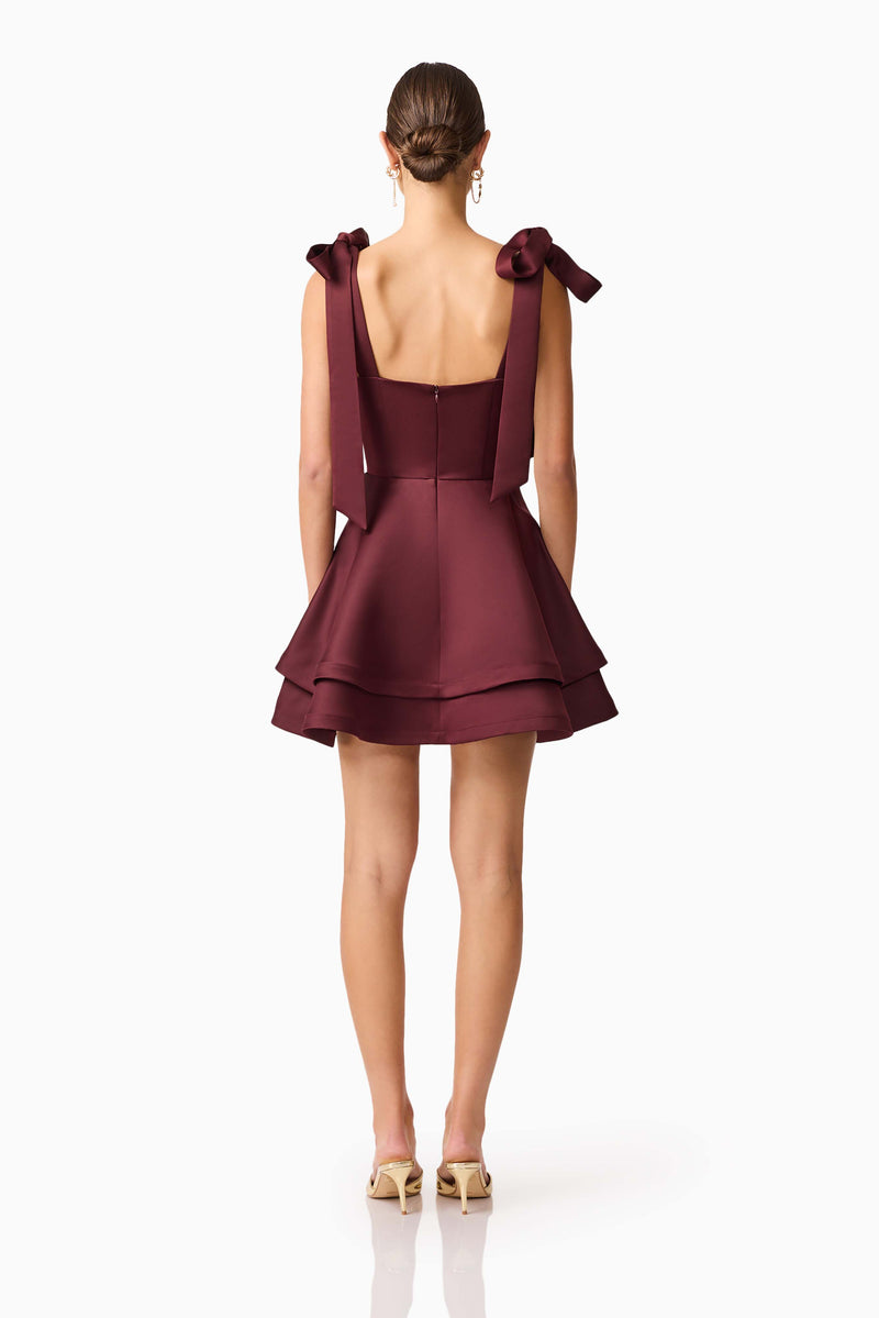 Brunette model wearing Livia Tiered Tiered Mini Dress in Red back shot