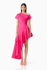 Brunette model wearing the Livia Asymmetrical Gown in Pink front shot