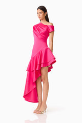 Brunette model wearing the Livia Asymmetrical Gown in Pink side shot