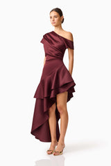 Brunette model wearing Livia Asymmetrical Gown in Red side shot