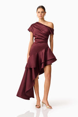 Brunette model wearing Livia Asymmetrical Gown in Red posed shot