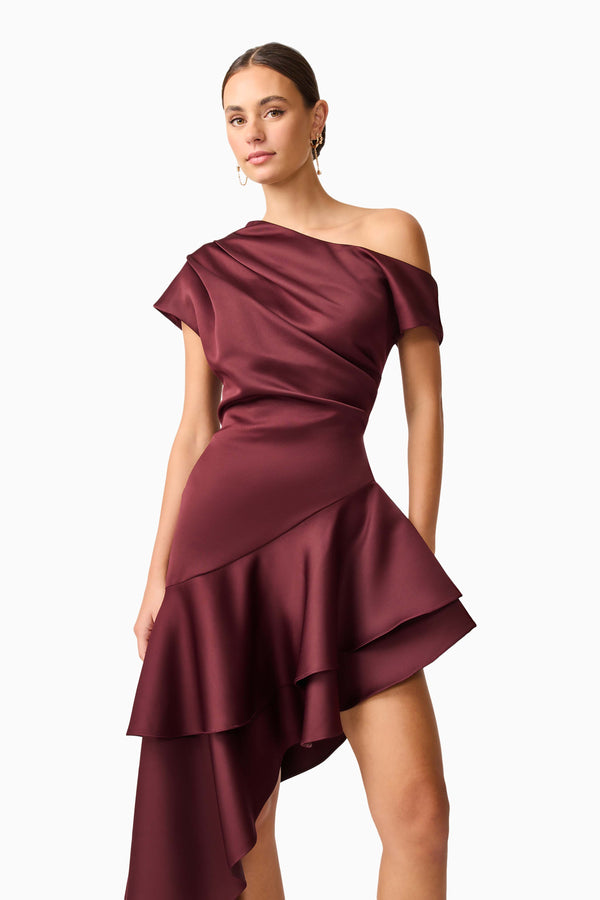 Brunette model wearing Livia Asymmetrical Gown in Red close up posed shot