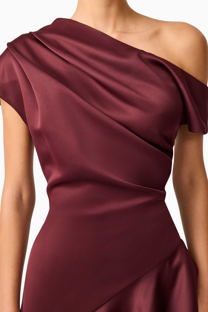 Brunette model wearing Livia Asymmetrical Gown in Red detail shot