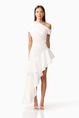 Brunette model wearing Livia Asymmetrical Gown in White front shot