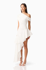 Brunette model wearing Livia Asymmetrical Gown in White side shot