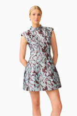 Bloomia Tulip Mini Dress in Brown & Blue Floral with a high neckline and sleeveless design close up shot