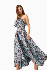 Bloomia A-Line Gown in Brown & Blue Floral with strapless neckline & jacquard fabrication close up walking shot