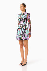 Veloria Long Sleeve Mini Dress in Black & Pastel Floral with a high neckline side shot 