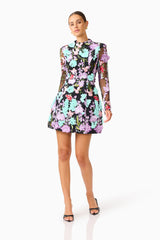Veloria Long Sleeve Mini Dress in Black & Pastel Floral with a high neckline posed shot 