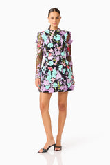 Veloria Long Sleeve Mini Dress in Black & Pastel Floral with a high neckline posed shot 