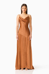 Brunette model wearing the Clementine Cowl Neck Gown in Brown front shot 