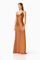 Brunette model wearing the Clementine Cowl Neck Gown in Brown side shot 