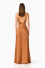 Brunette model wearing the Clementine Cowl Neck Gown in Brown back shot 