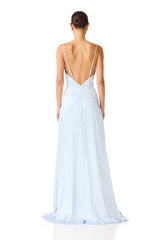 Brunette model wearing the Clementine Cowl Neck Gown in Pale Blue back shot 