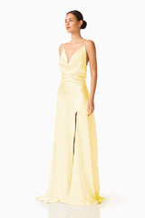 Brunette model wearing the Clementine Cowl Neck Gown in Butter Yellow side shot 
