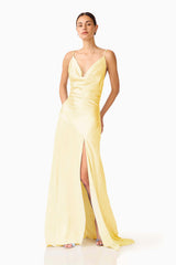 Brunette model wearing the Clementine Cowl Neck Gown in Butter Yellow posed shot 