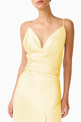 Brunette model wearing the Clementine Cowl Neck Gown in Butter Yellow detail shot 