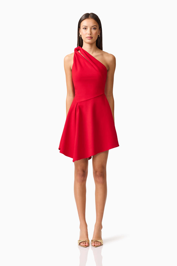 Brunette model wearing the Lila Asymmetrical Mini Dress in Red Front shot