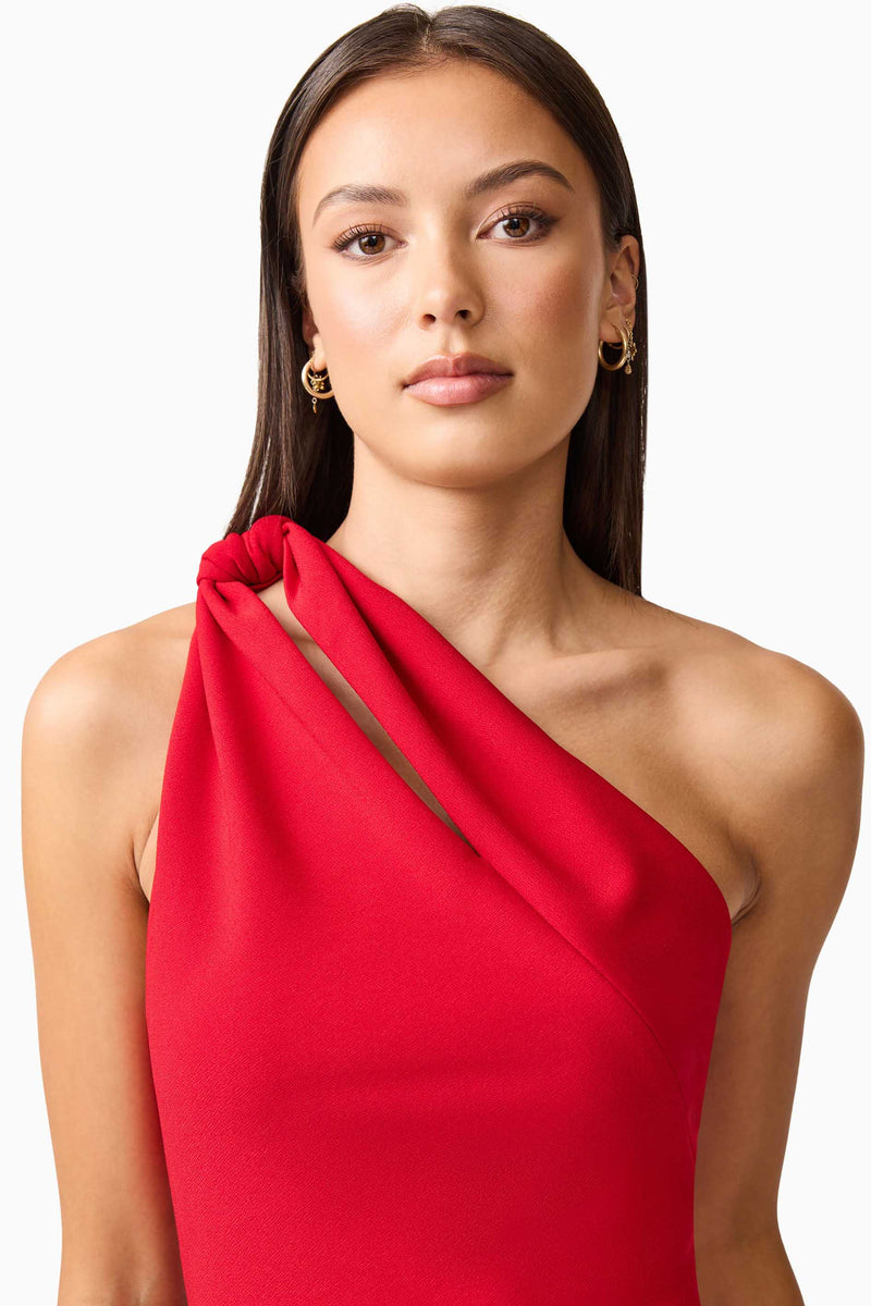 Brunette model wearing the Lila Asymmetrical Mini Dress in close up shot