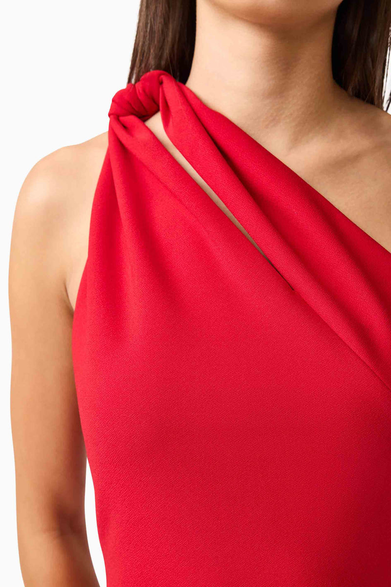 Brunette model wearing the Lila Asymmetrical Mini Dress in Red detail shot