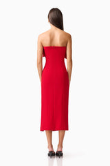 Brunette model wearing the Lila Fitted Midi Dress in Red back shot