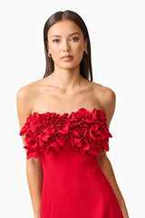 Brunette model wearing the Lila Fitted Midi Dress in Red close up shot