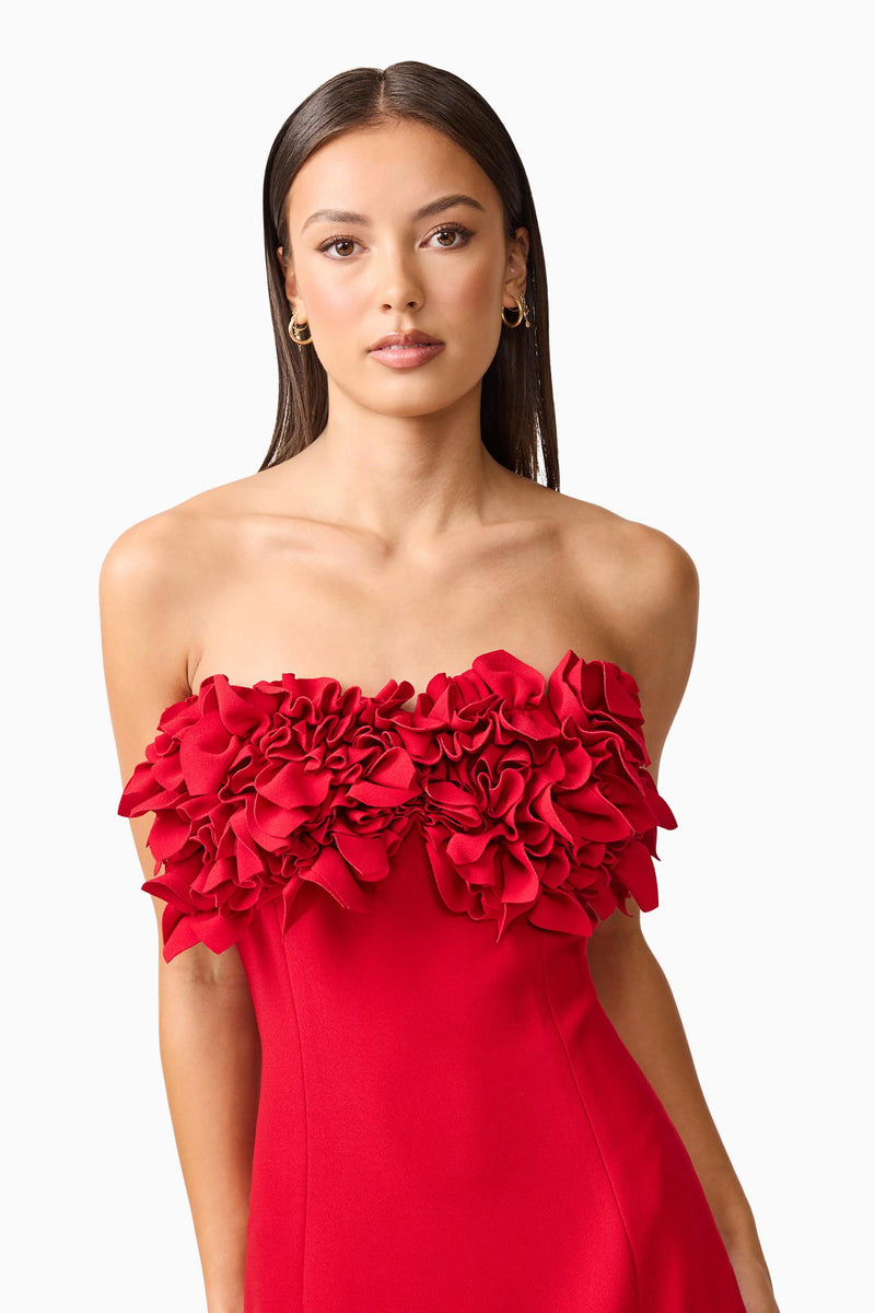 Brunette model wearing the Lila Fitted Midi Dress in Red close up shot