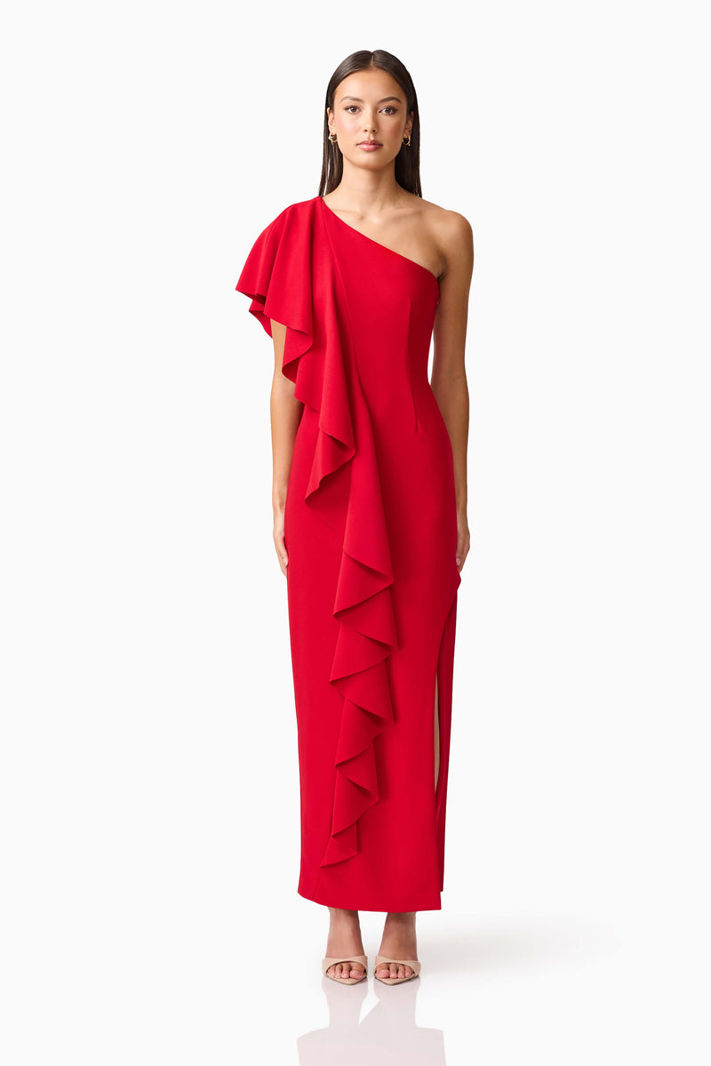 Brunette model wearing the Lila Asymmetrical Gown in Red front shot