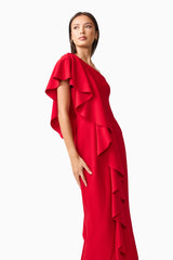 Brunette model wearing the Lila Asymmetrical Gown in Red close up shot