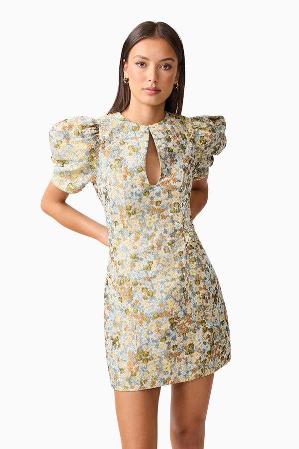 Brunette model wearing Tasmin Puff Sleeve Mini Dress in Blue & Yellow close up Posed Shot