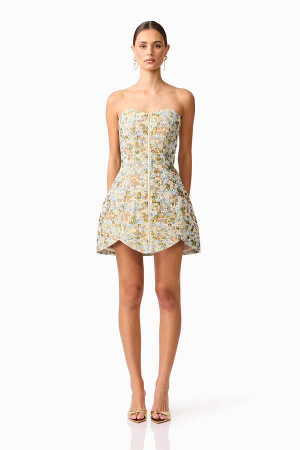 Brunette model wearing Tasmin Strapless Mini Dress in Blue & Yellow Floral front shot 