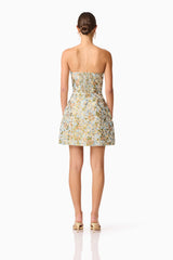 Brunette model wearing Tasmin Strapless Mini Dress in Blue & Yellow Floral back shot 