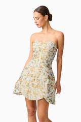 Brunette model wearing Tasmin Strapless Mini Dress in Blue & Yellow Floral close up shot 