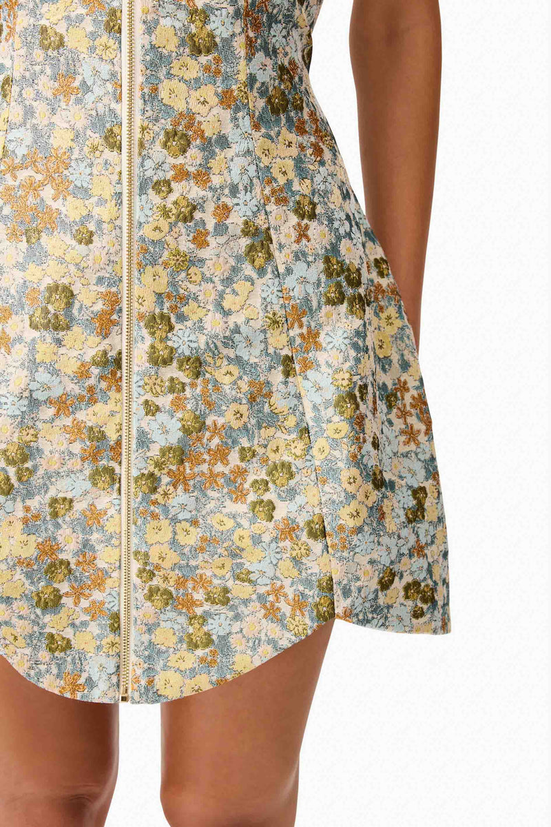 Brunette model wearing Tasmin Strapless Mini Dress in Blue & Yellow Floral detail shot 