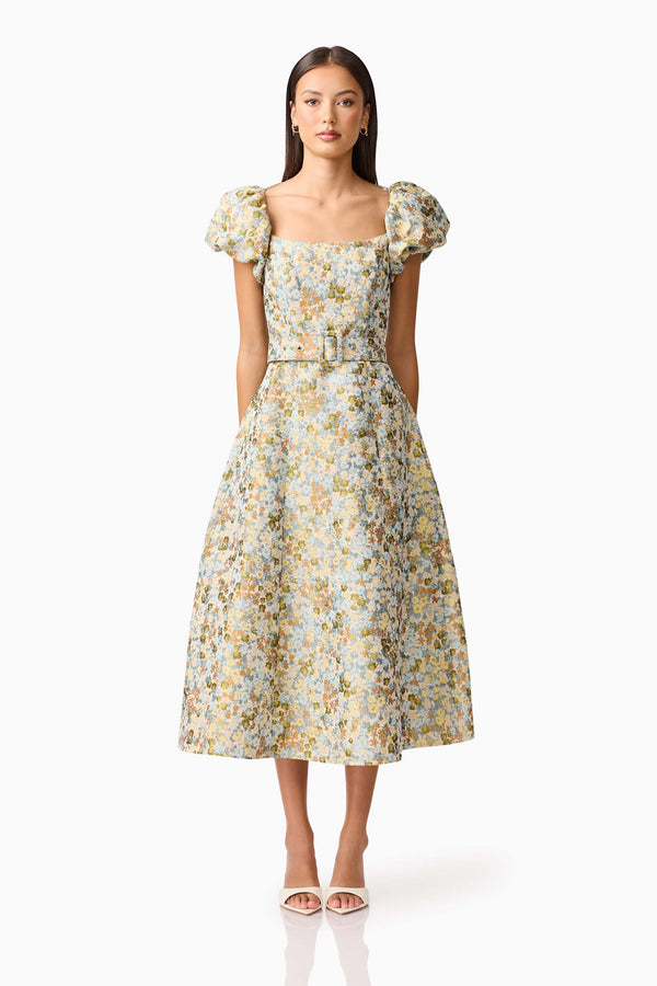 Brunette model wearing Tasmin Puff Sleeve Midi Dress in Blue & Yellow Floral Front Shot