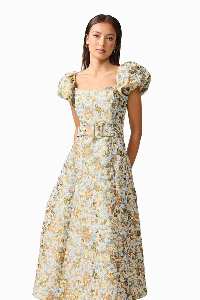 Brunette model wearing Tasmin Puff Sleeve Midi Dress in Blue & Yellow close up Shot