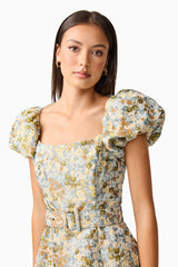 Brunette model wearing Tasmin Puff Sleeve Midi Dress in Blue & Yellow Floral detail Shot