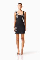 Brunette model wearing the Soleil Party Mini Dress in Black front shot