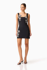 Brunette model wearing the Soleil Party Mini Dress in Black posed shot