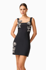 Brunette model wearing the Soleil Party Mini Dress in Black close up posed shot