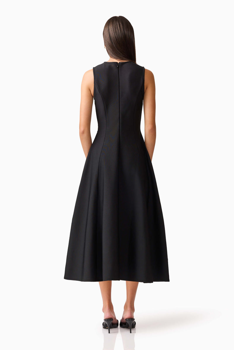 Brunette model wearing the Soleil A-Line Midi Dress in Black Back Shot