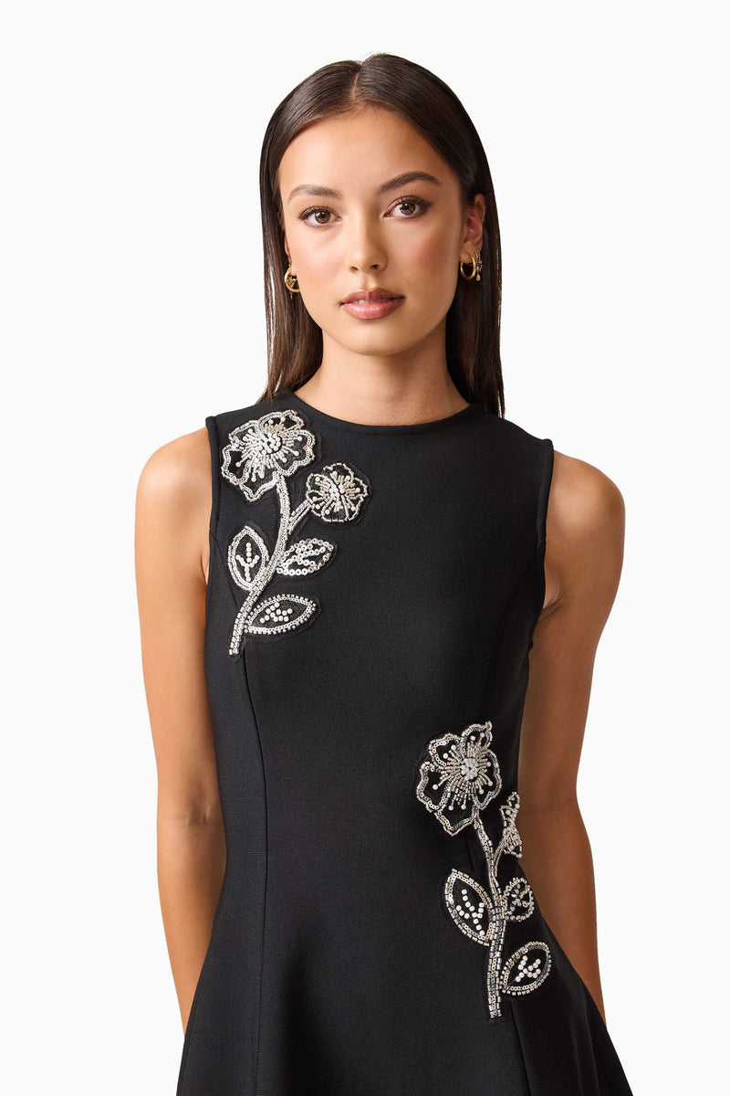Brunette model wearing the Soleil A-Line Midi Dress in Black Close Up Shot