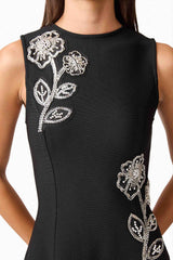 Brunette model wearing the Soleil A-Line Midi Dress in Black Detail Shot