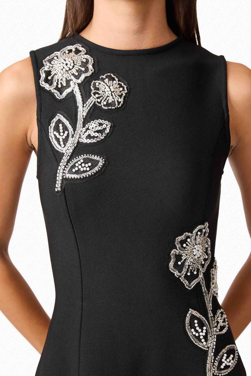 Brunette model wearing the Soleil A-Line Midi Dress in Black Detail Shot