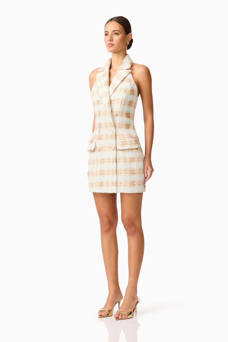 Brunette model wearing Ashlyn Halter Tweed Mini Dress in White & Gold side shot