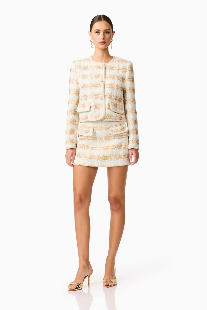 Brunette model wearing Ashlyn Long Sleeve Tweed Set in White & Gold posed shot