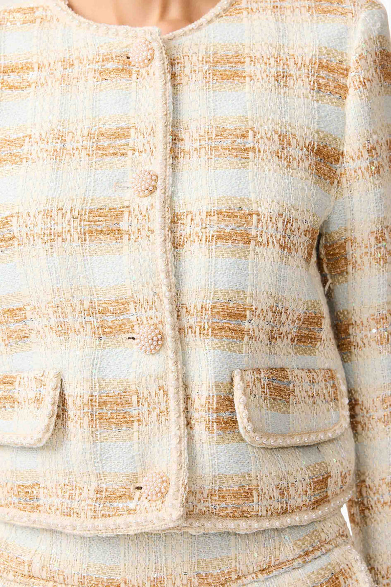 Brunette model wearing Ashlyn Long Sleeve Tweed Set in White & Gold detail shot
